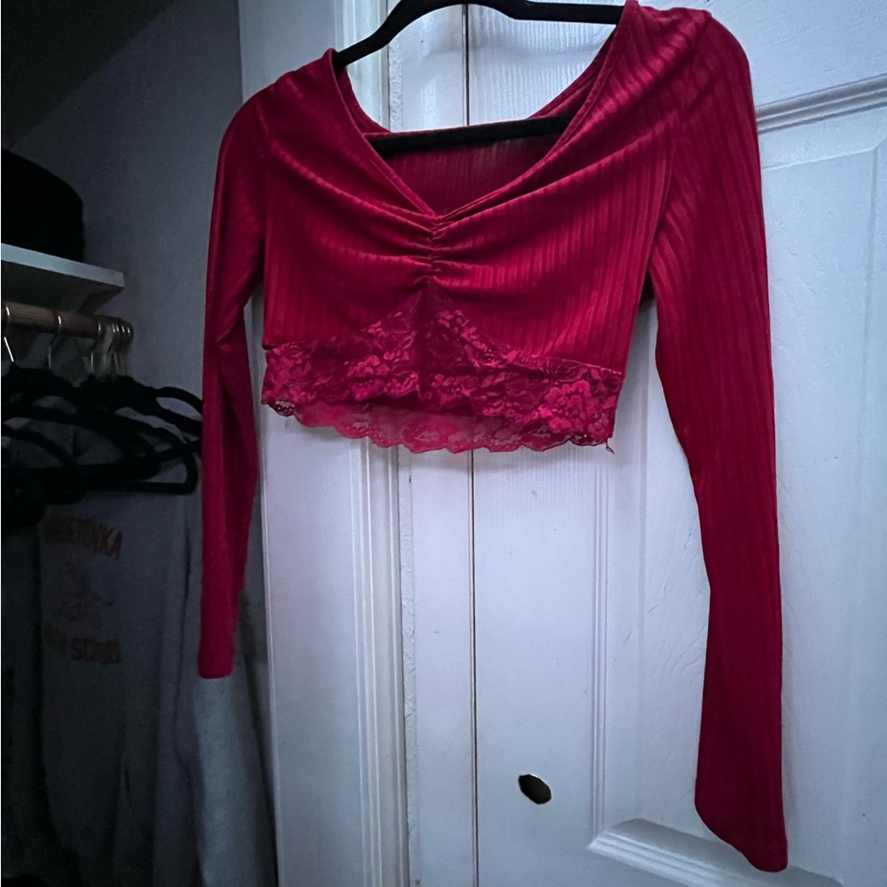 I’m selling this Shein top, it’s a small, it’s a deep red, almost burgundy